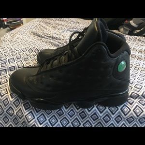 All black with the green trim on the sole Jordan’s